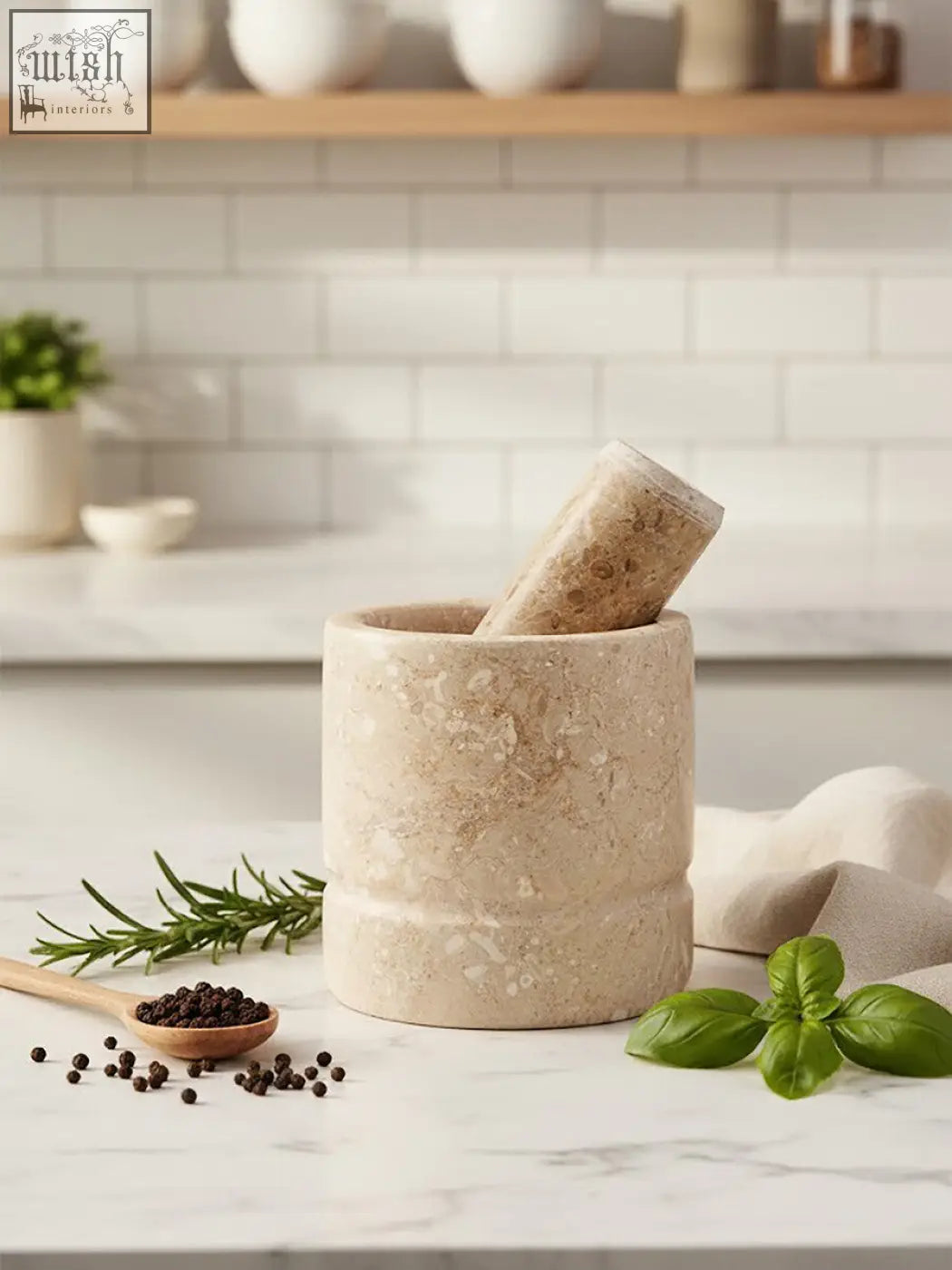 Beige stone marmore cream marble mortar and pestle with fresh herbs and peppercorns for grinding spices