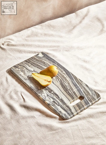 Gray and white marbled marmore rectangular black marble chopping and serving board with handle cutout