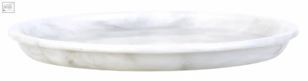 White marble marmore round marble plant saucer with smooth raised rim and subtle veining round marble plate
