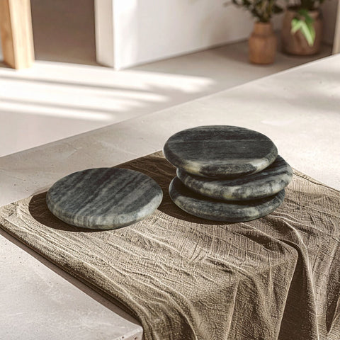 Stacked dark green marble coasters with white veining on brown cloth from marmore set of 4 grey marble round coasters