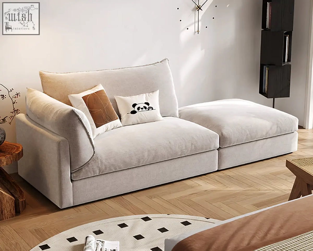 Beige velvet marquez two seater sofa with plush cushions and a panda-themed accent pillow perfect for cozy seating