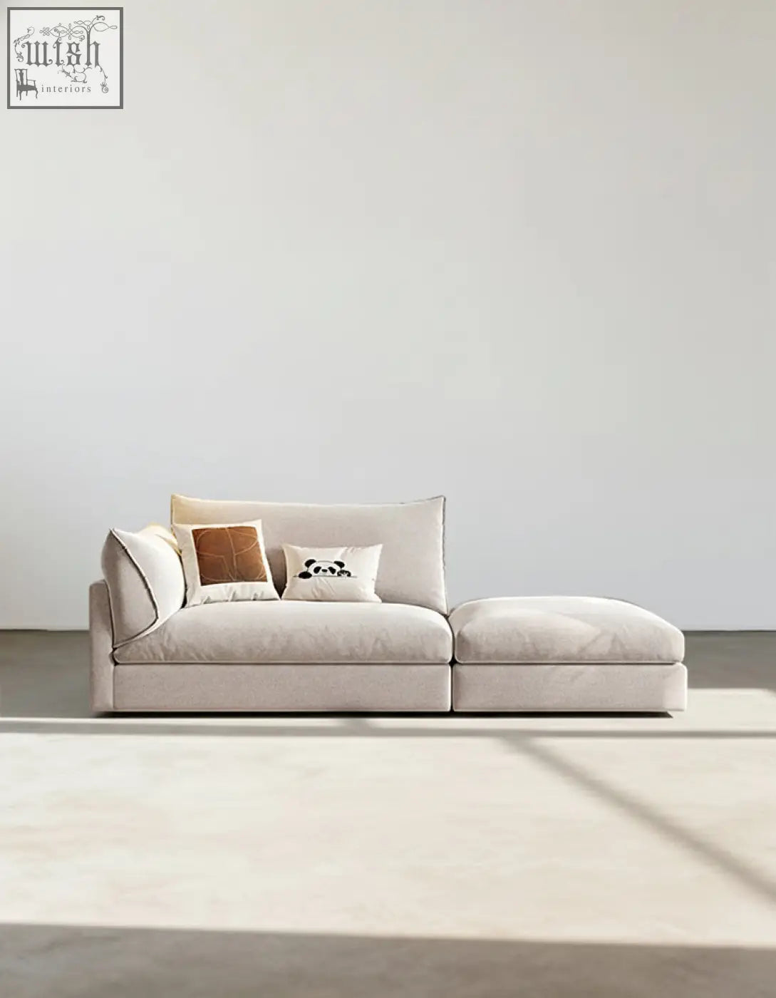 Beige linen marquez two seater sofa with chaise lounge and three decorative pillows for cozy seating