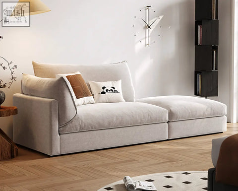 Beige velvet marquez two seater sofa with plush cushions and playful panda-patterned accent pillow