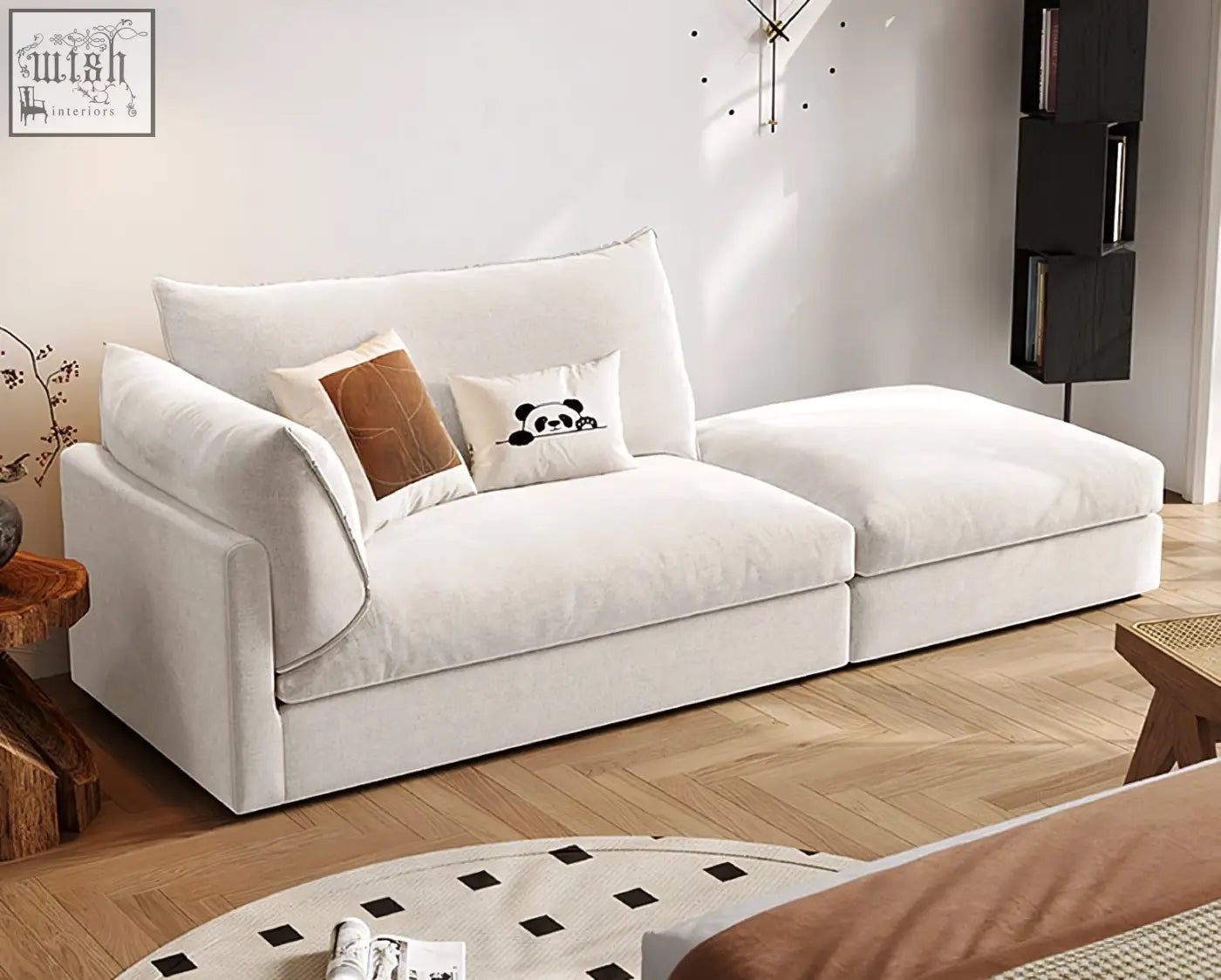 Cream-colored velvet marquez two seater sofa with plush cushions and a panda accent pillow in linen style