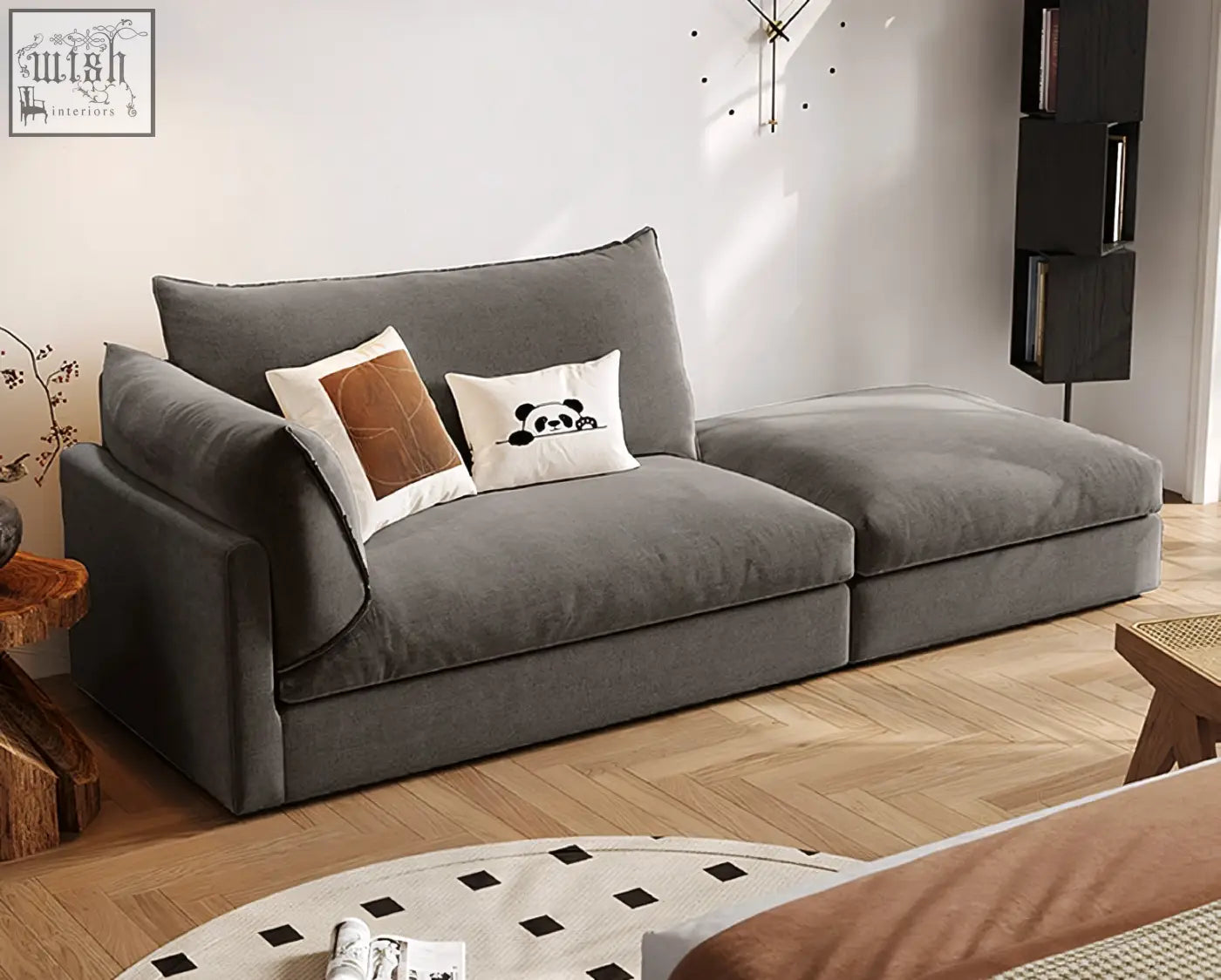 Modern gray velvet marquez two seater sofa with plush cushions and decorative throw pillows for cozy seating