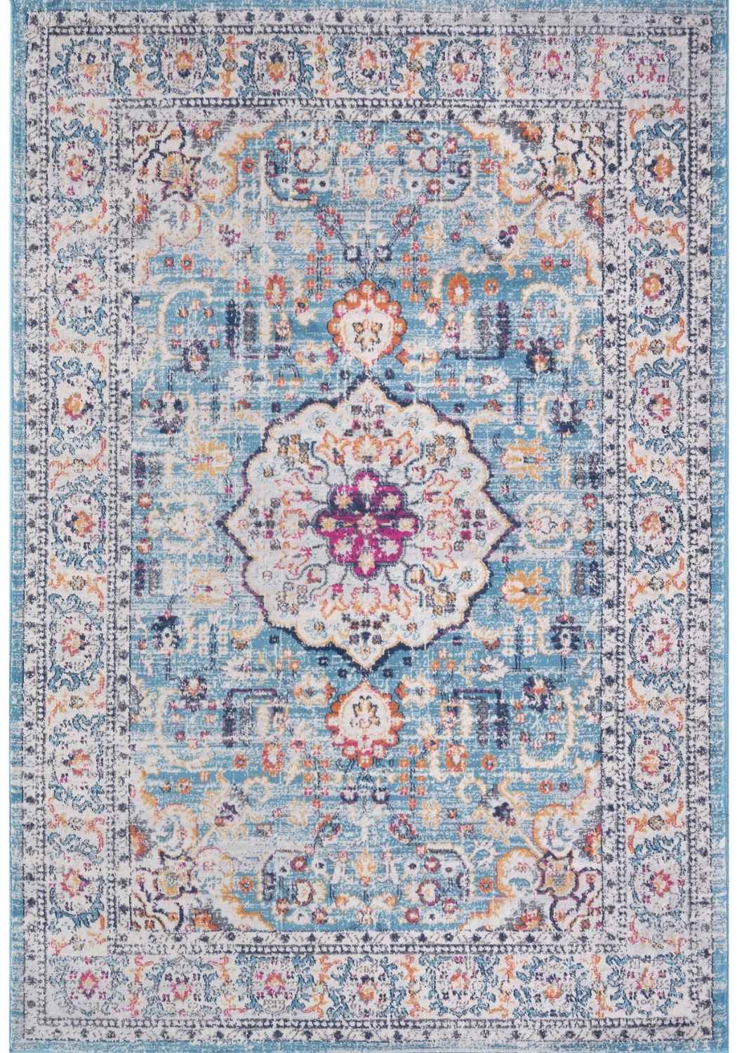 A marrakech vintage area rug featuring faded blue and cream tones with intricate pink and purple floral patterns
