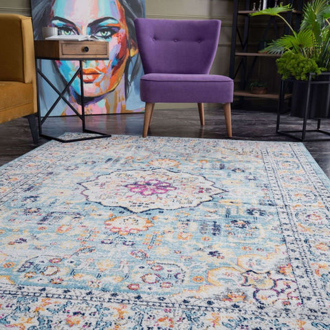 A marrakech vintage area rug with faded blue cream base floral patterns and detailed border designs