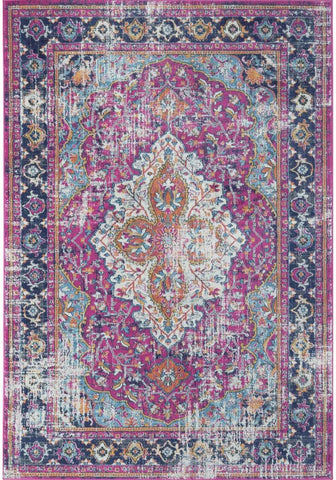 Vibrant pink and teal distressed marrakech vintage rug with intricate floral and geometric patterns in vintage style
