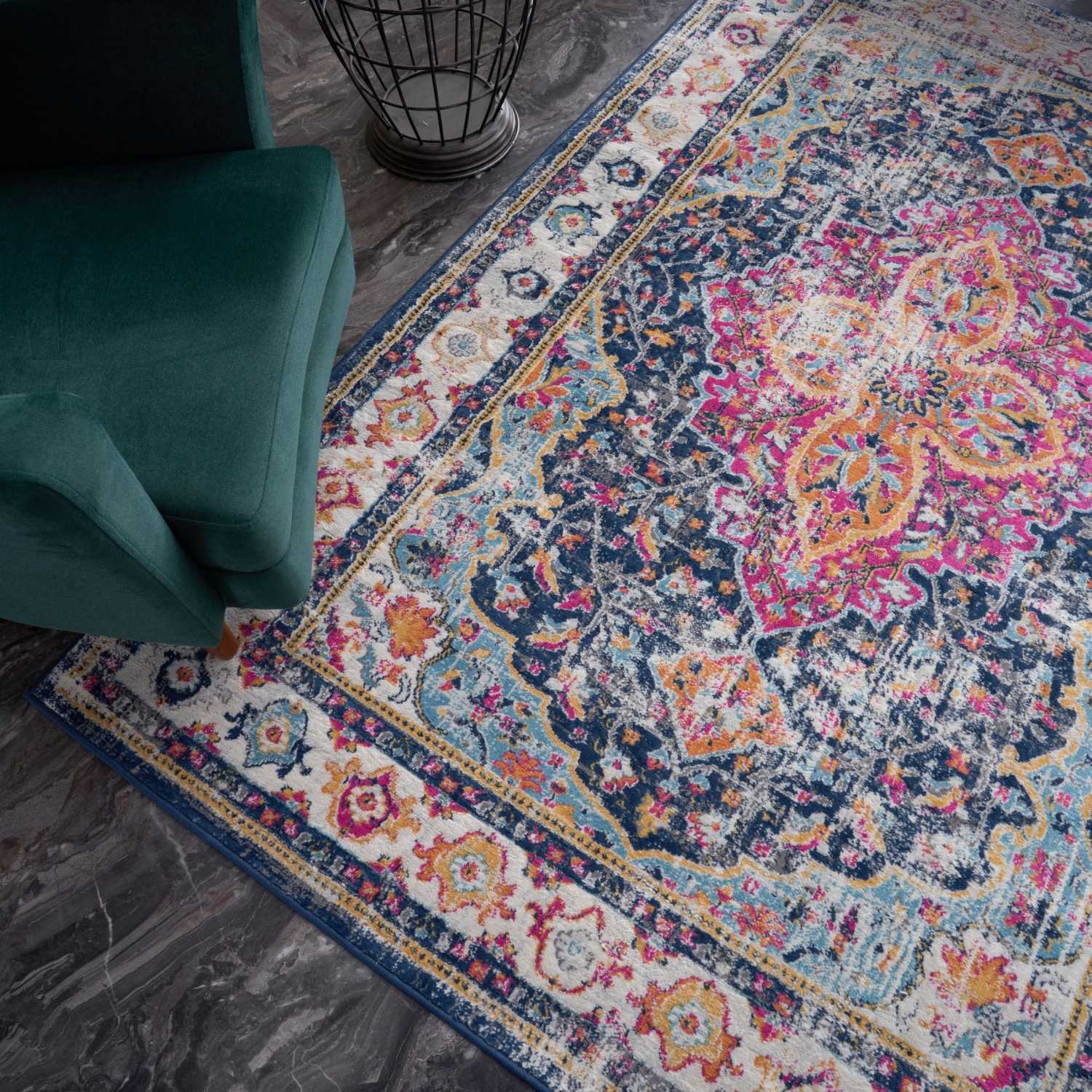 Vibrant distressed marrakech vintage rug featuring intricate floral and geometric patterns in navy blue pink orange and cream