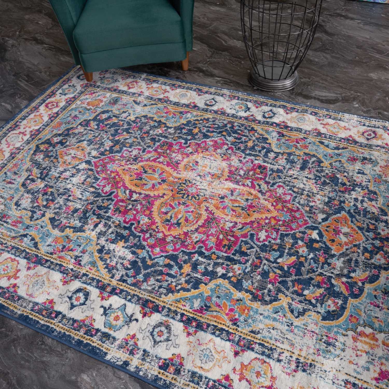 Vibrant distressed marrakech vintage area rug with intricate floral geometric patterns in navy pink orange and cream tones