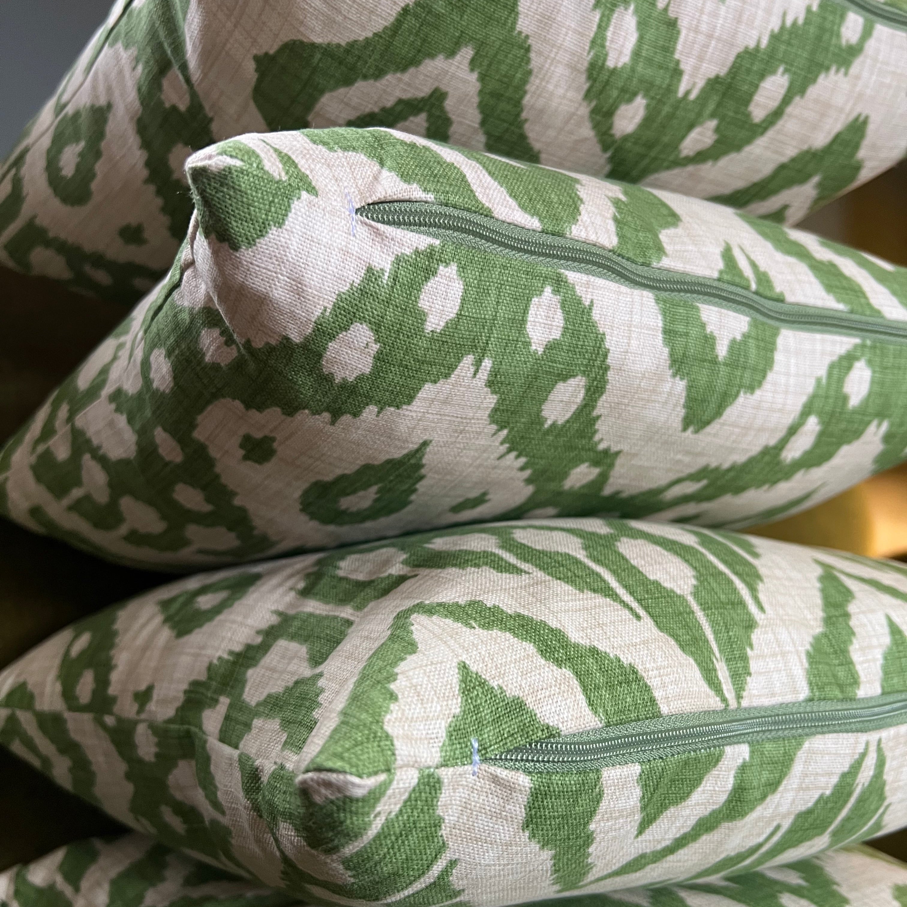 Marrakesh green cotton scatter cushions with green and cream ikat pattern and hollow fibre cushion filling