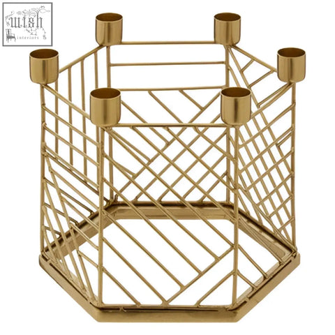 Martina hexagonal candle holder in gold tone with geometric wireframe and six cylindrical cup holders for candles