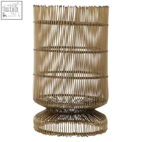 Golden-toned cylindrical woven wire candle holder with flared base and tiered bands for stylish candle display