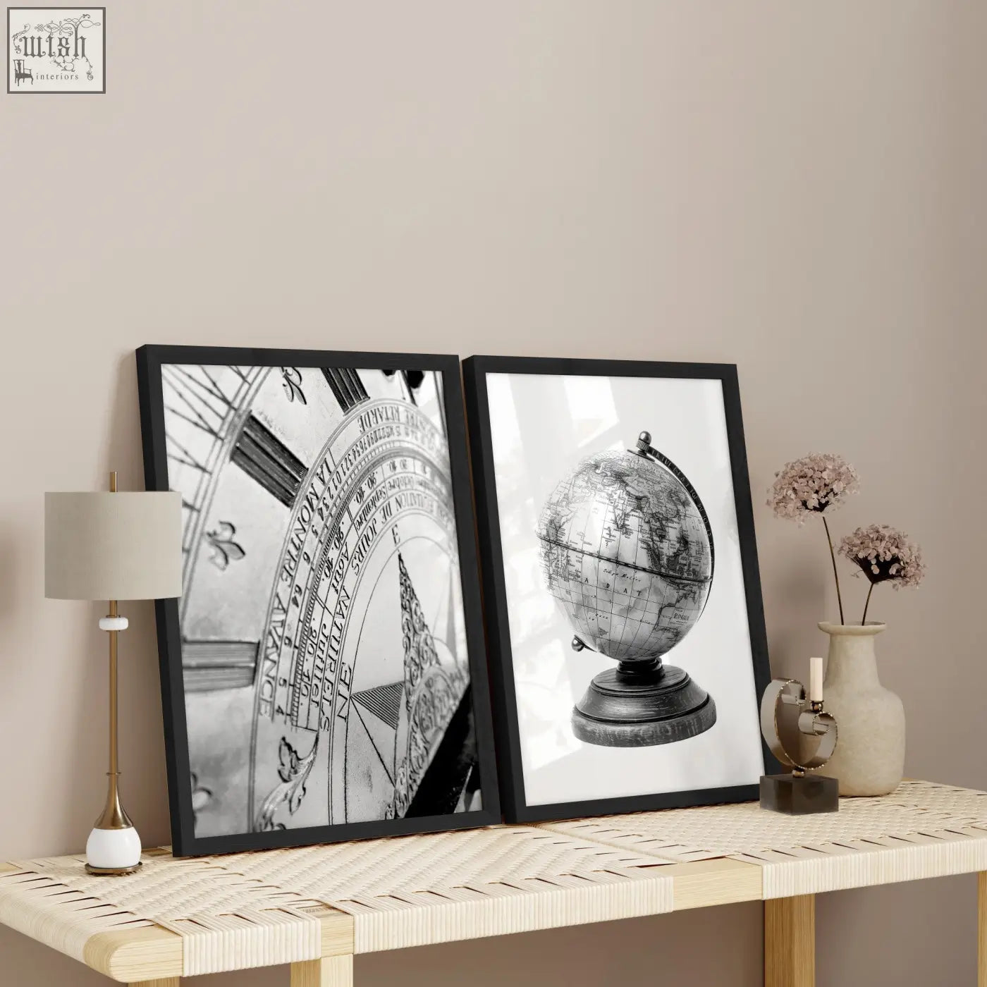 Two black-framed masculine wall art prints featuring a vintage sundial and antique globe on a woven table