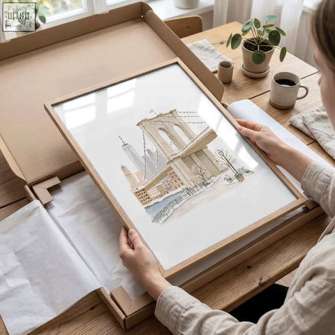Framed watercolor wall art print of the brooklyn bridge in a light wood frame perfect for master bedroom art