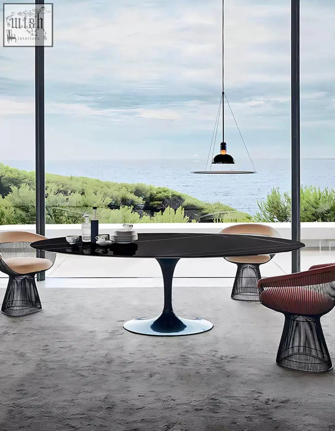 Black oval dining table with sleek glossy marble surface and single pedestal base perfect for oval dining spaces
