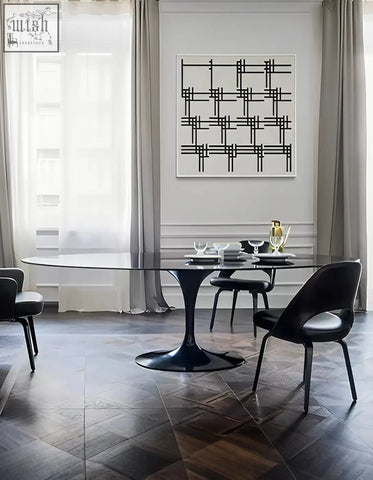 Black glass masuda oval dining table with sleek tulip-shaped base perfect for stylish oval dining spaces