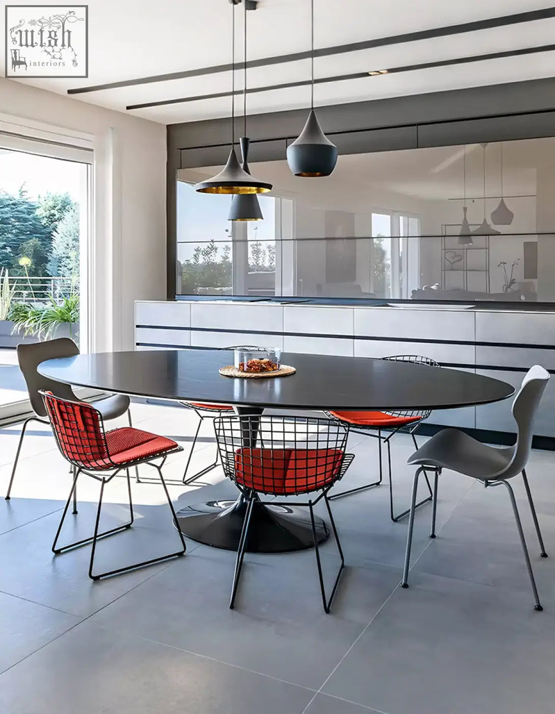Black masuda oval dining table with sleek marble top and modern pedestal base perfect for stylish oval dining spaces