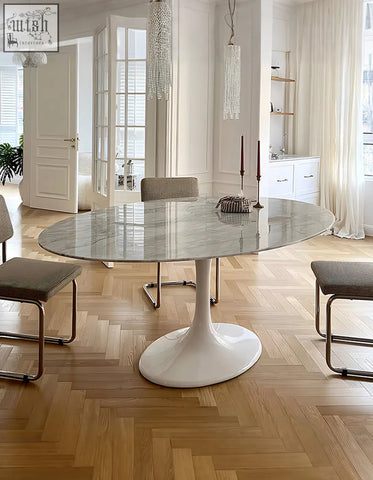 White marble oval dining table with sleek pedestal base ideal for modern oval dining spaces masuda oval dining table