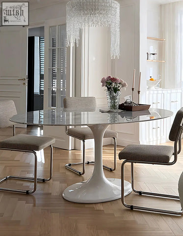 White glass top Masuda oval dining table with sleek curved pedestal base perfect for oval dining spaces