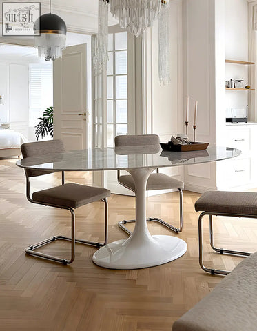 White glass-top masuda oval dining table with sleek sculptural pedestal base perfect for stylish oval dining