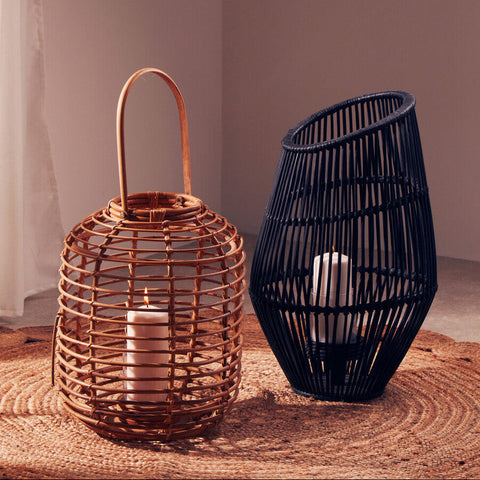 Mataram tall natural rattan lantern with natural woven rattan, curved handle, and ivory candle inside