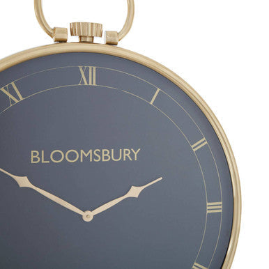 Mateo pocket watch design large wall clock featuring a gold-toned body navy blue face and bloomsbury roman numerals watch design large