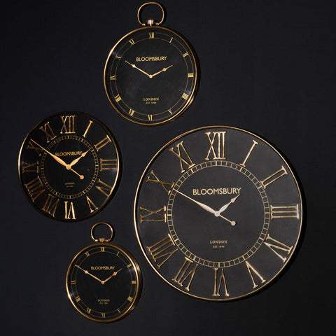 Set of four elegant black and gold bloomsbury wall clocks with roman numerals featuring a pocket watch design large style