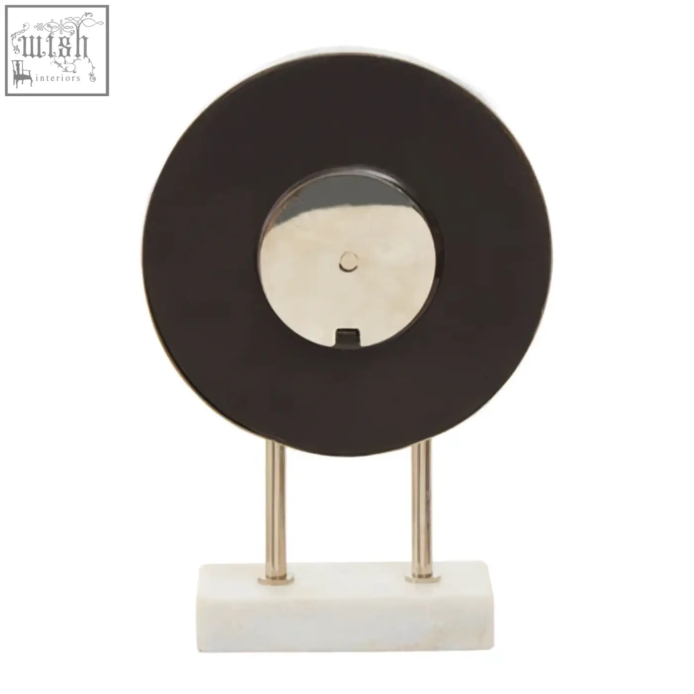 Black vinyl record clock with silver center and chrome legs on a white marble base featuring a sleek marble base design