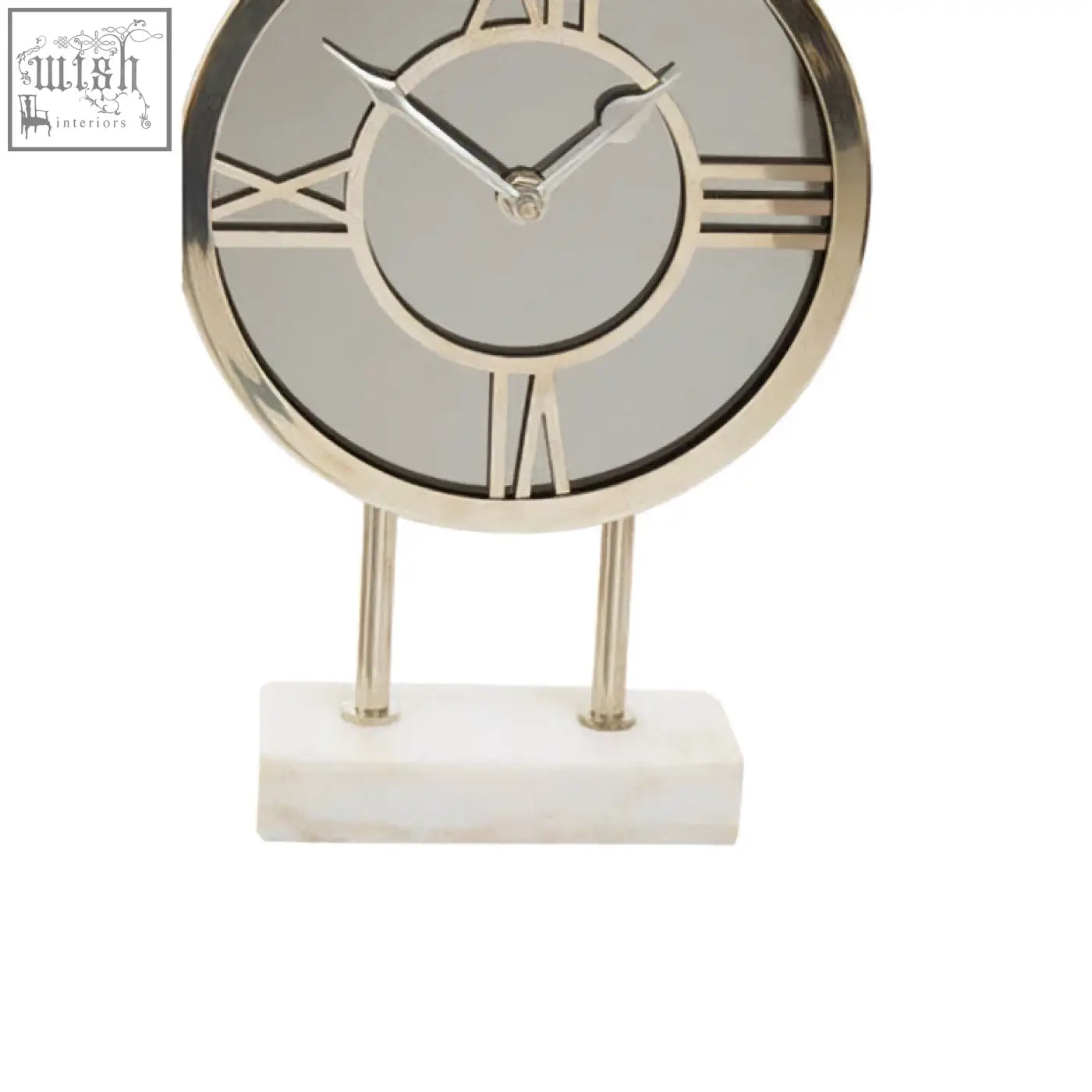 Silver-framed clock with roman numerals and mirrored face standing on a white marble base with marble base design