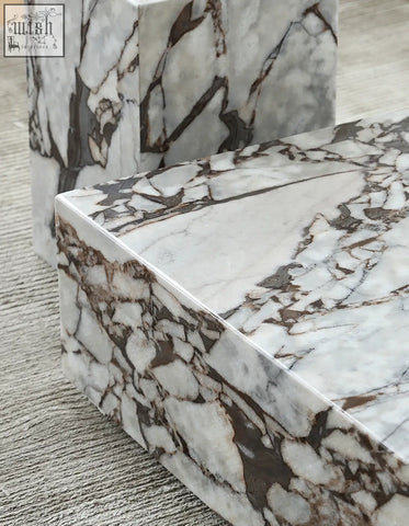 Matteo square coffee table featuring white and brown veined marble with a polished geometric design square coffee table