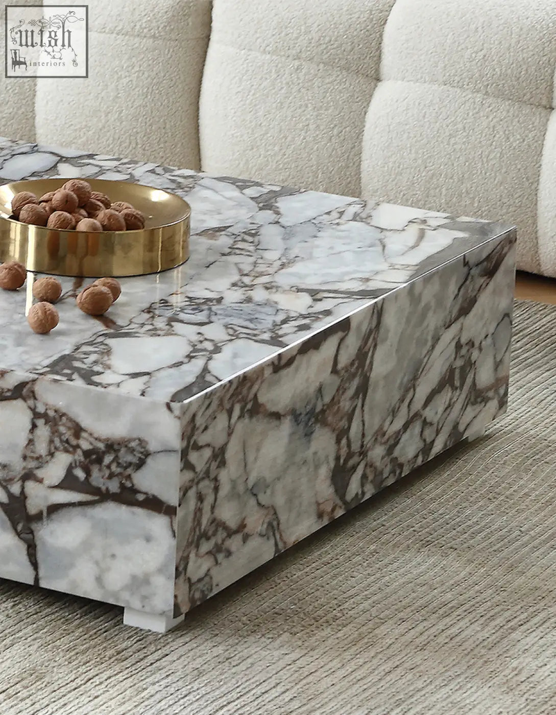 Matteo square coffee table with a sleek white marble top featuring gray and brown veining and minimalist legs