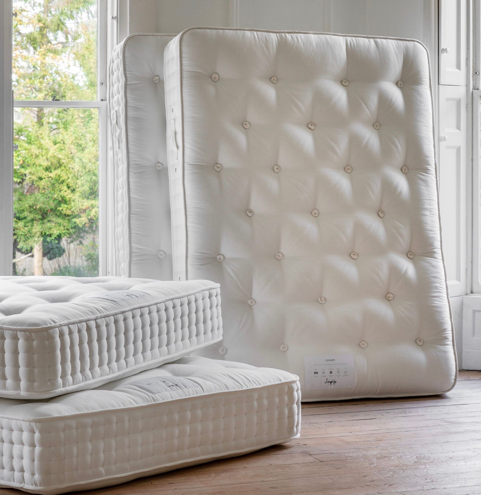 White tufted mattress with button detailing and quilted edge for mattress luxury 4000 springs item width and depth