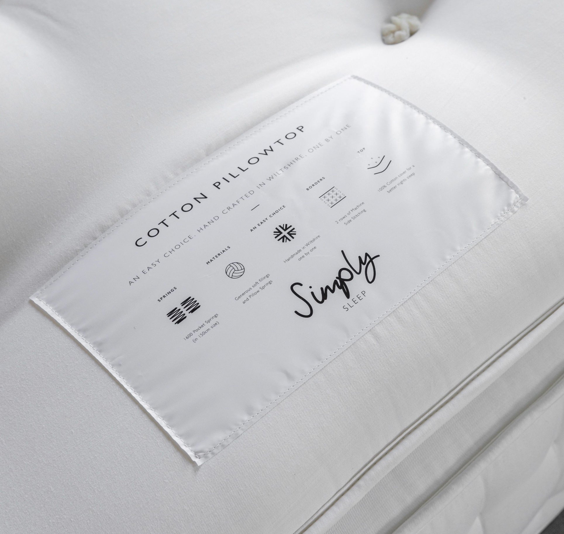 White cotton label on luxury pillow mattress with minimalist black text for double 1600 springs pillow top