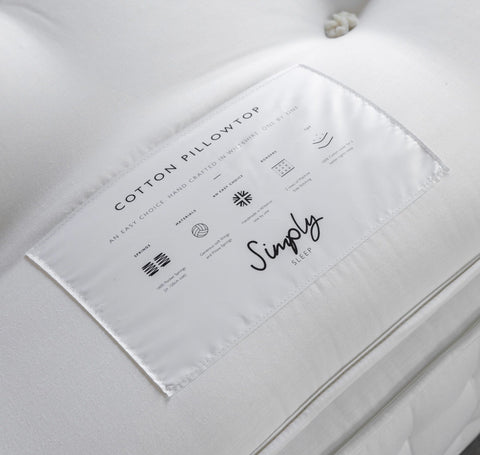 White cotton label on luxury pillow mattress with minimalist black text for double 1600 springs pillow top