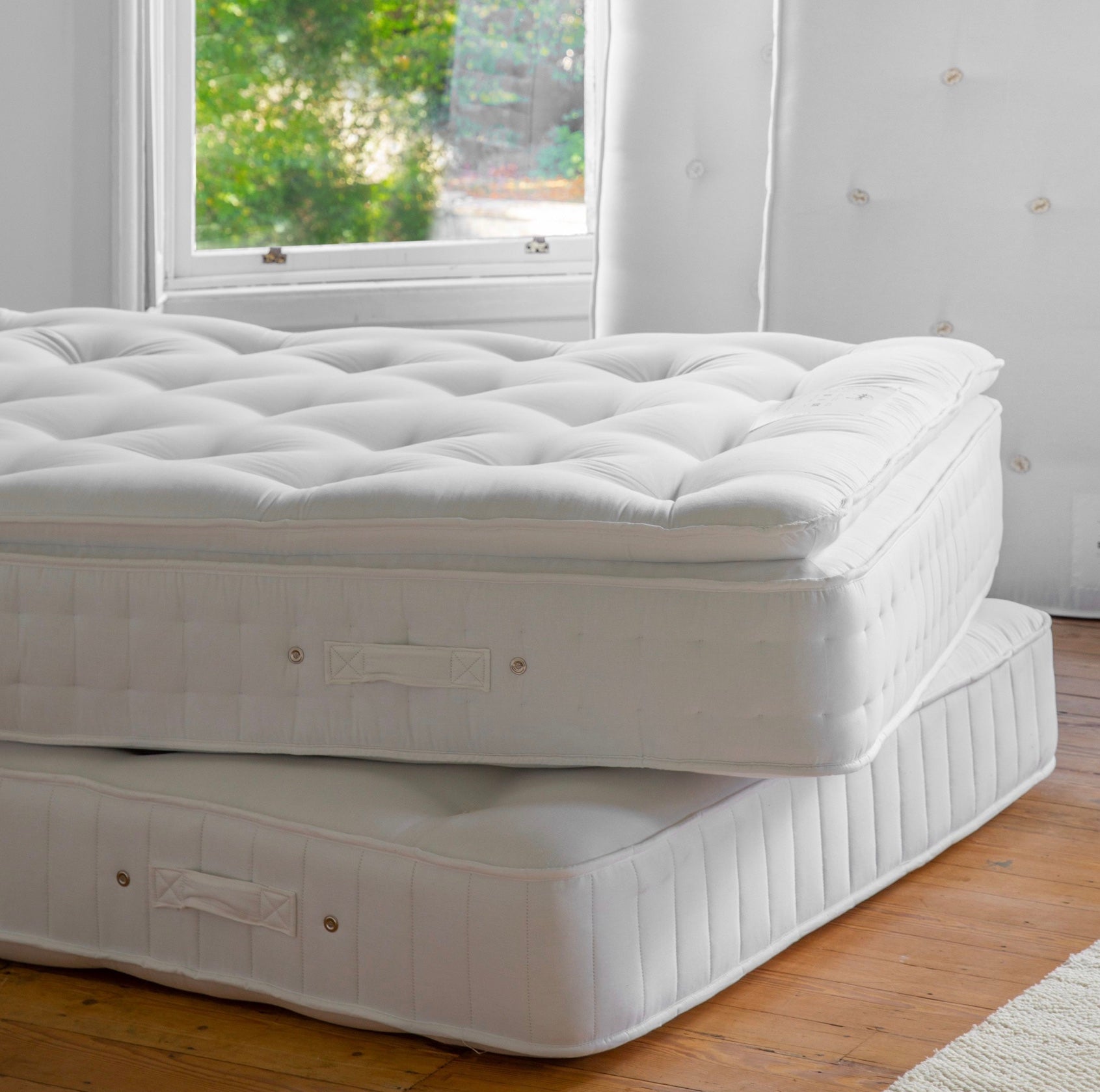 White quilted luxury pillow top mattress topper with tufted diamond pattern on a super king mattress