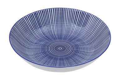 A blue and white ceramic bowl with radial fine lines from the maya 12 piece blue and white dinner set perfect for your white dinner