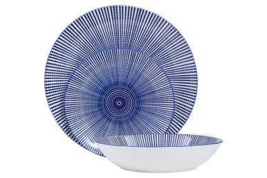 Blue and white ceramic dinner set with concentric circular patterns perfect for a stylish white dinner table setup