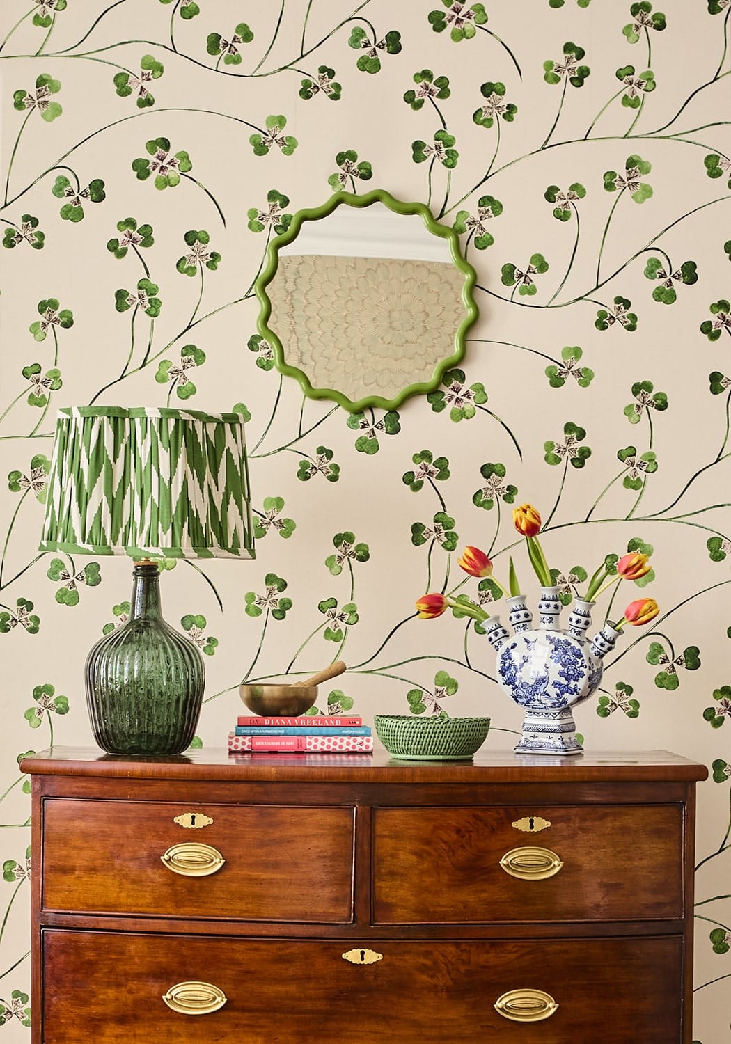 Green scalloped mirror with textured light beige reflective surface in mayfair tray hold all rattan basket in green
