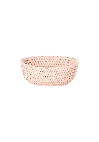 A blush pink mayfair trinket hold all rattan basket with a tight woven weave and rounded edges