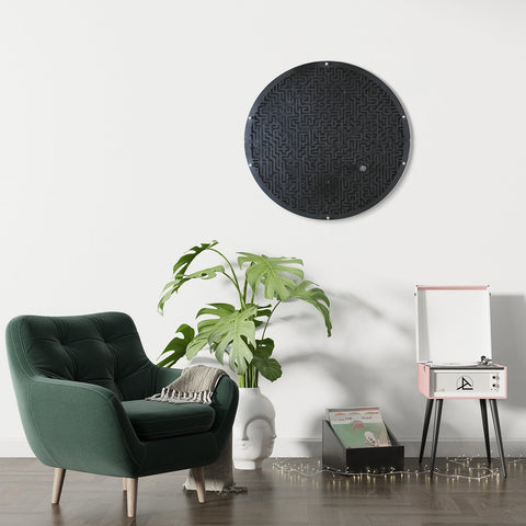 Black circular wall game with intricate maze pattern featuring a target area and ball holder for fun play