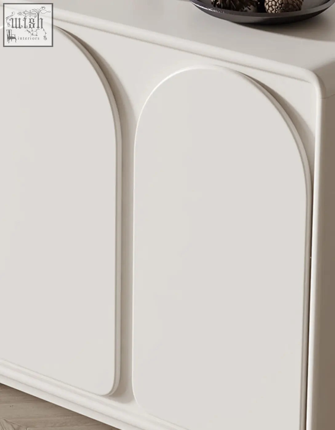 Cream mediterranean style sideboard with white smooth arched doors and clean lines for stylish storage