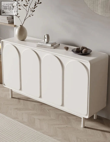White mediterranean style sideboard with cream finish four arched doors and slender legs perfect for stylish storage