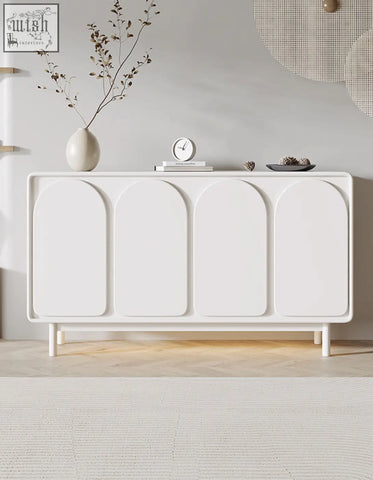 Cream mediterranean style sideboard with four arched doors and slender legs in a sleek style sideboard design