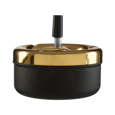 Medium gold and matte black spinning ashtray with a black spinning ashtray holder in the center