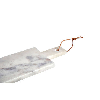 Medium white marble paddle serving board with gray veining and wooden handle tied with brown leather cord