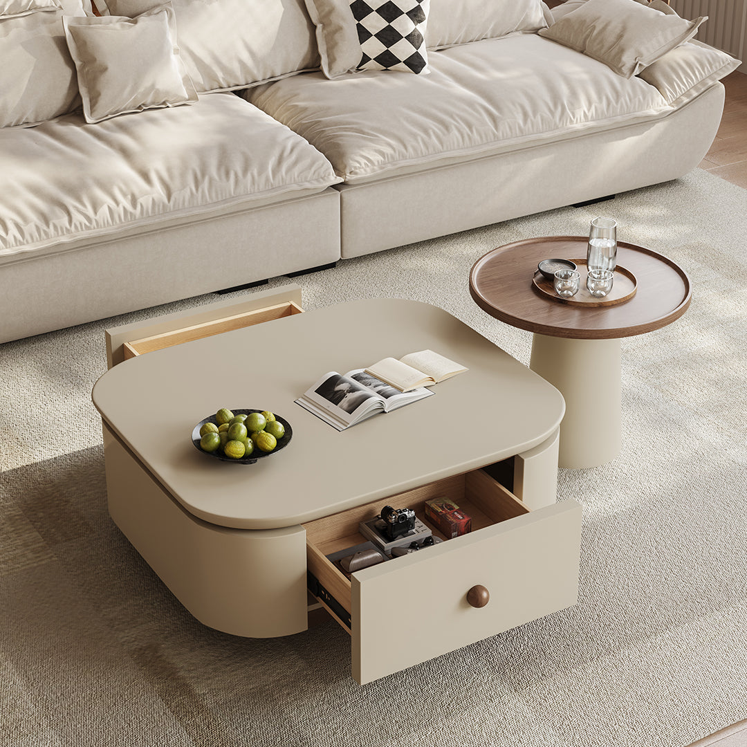 Cream-colored meer rectangle coffee table set with storage featuring rounded corners and a partially open drawer
