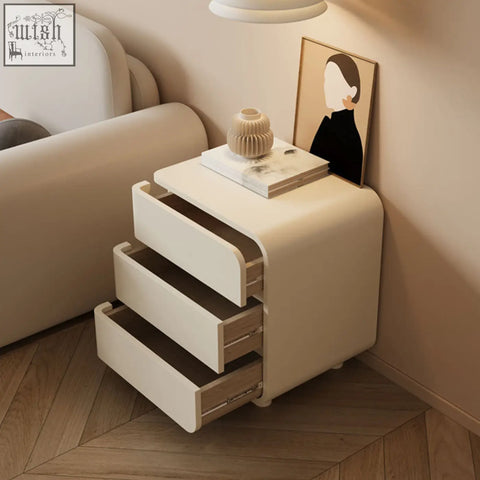 Cream meg bedside table with three sleek drawers and light wood interior accents perfect for minimalist spaces
