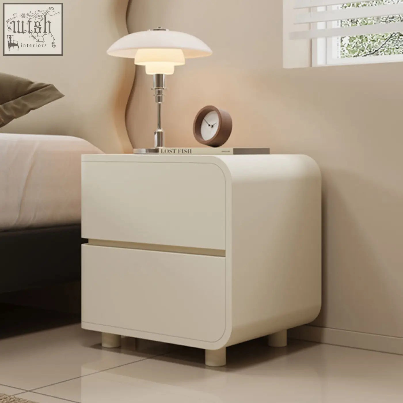 Cream-colored meg bedside table with two smooth drawers and rounded edges for modern bedroom storage