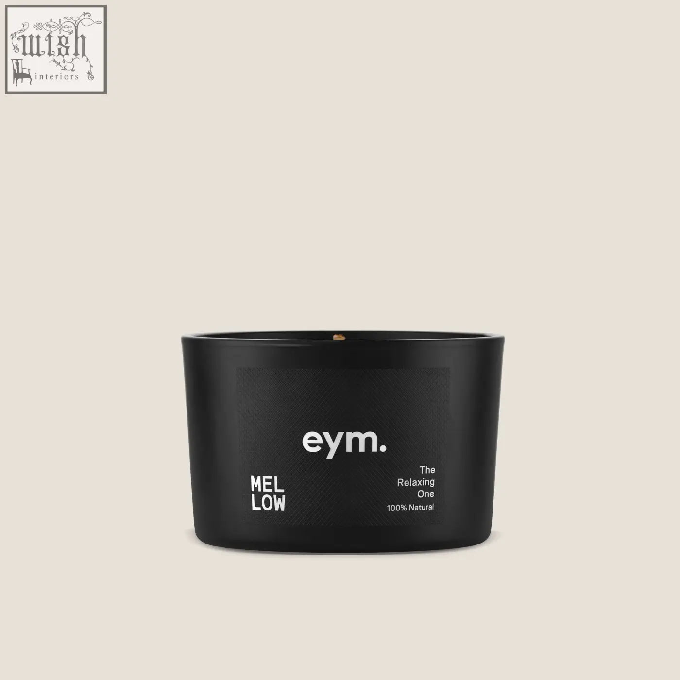 Black cylindrical mini candle in a matte container with simple white label from mellow collection